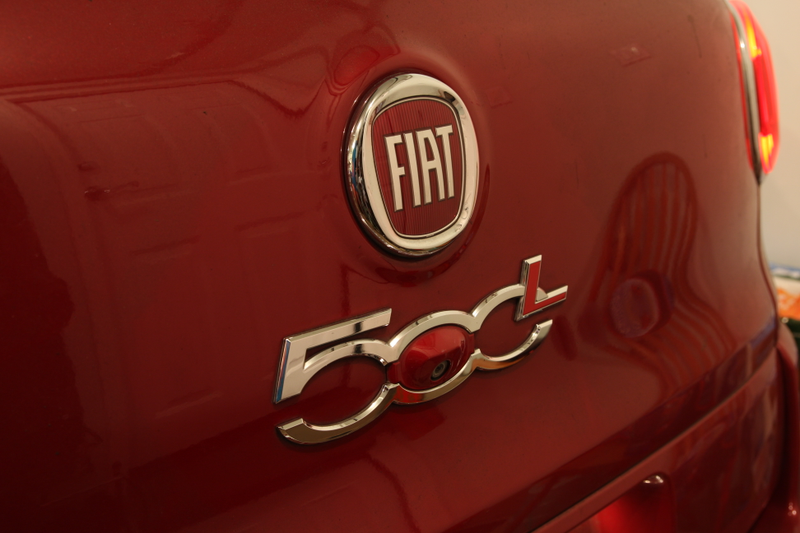 The rear-view parking camera is cleverly hidden within the rear “500L” logo.